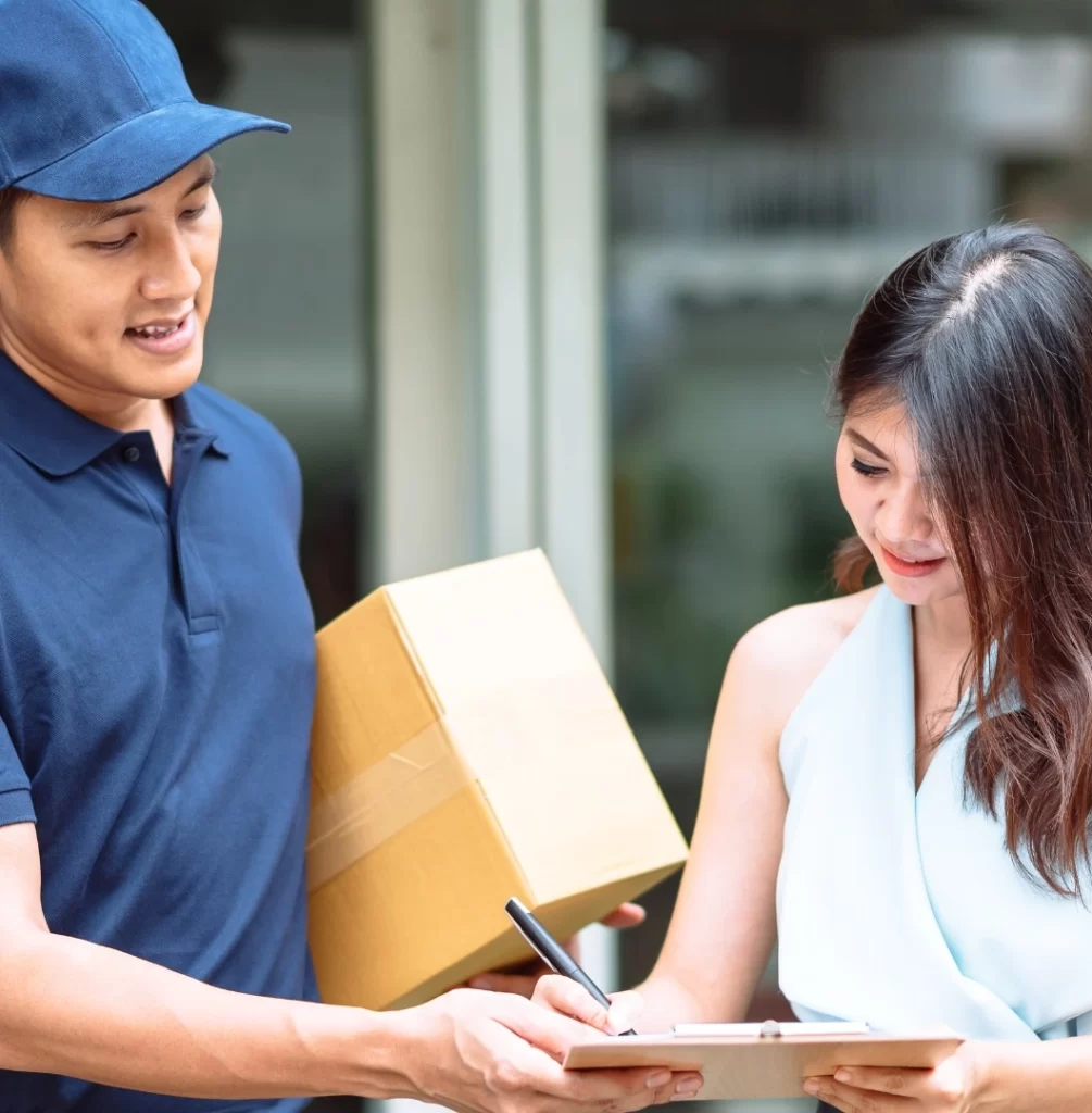 Delivery Person Receiving Package From Customer